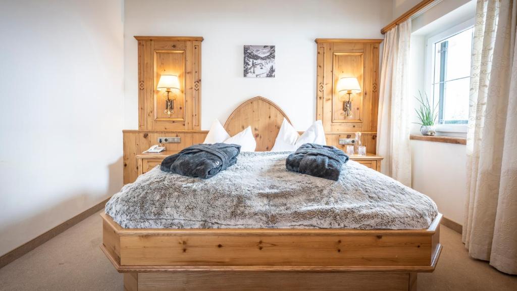 Кровать или кровати в номере Anthony´s Alpin Hotel Garni