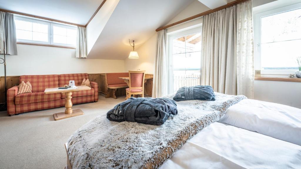 Кровать или кровати в номере Anthony´s Alpin Hotel Garni