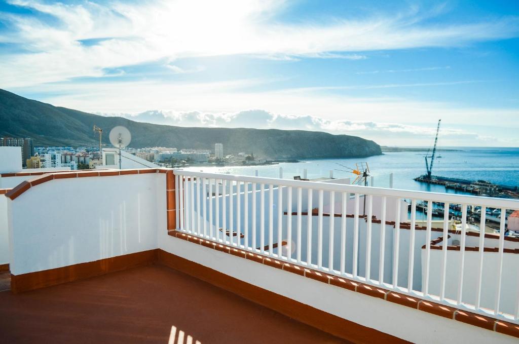 a balcony on a cruise ship with a view of the ocean at Banana Surf House in Los Cristianos