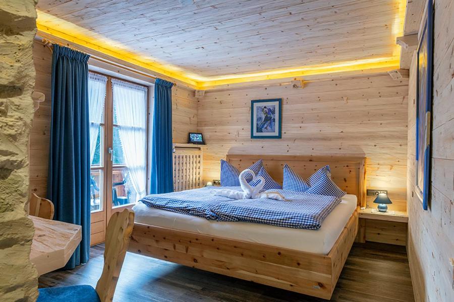 Postel nebo postele na pokoji v ubytování Almhotel Grünsteinblick