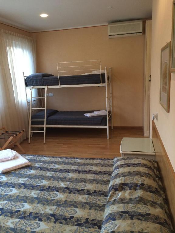 Postel nebo postele na pokoji v ubytování Hotel Concordia