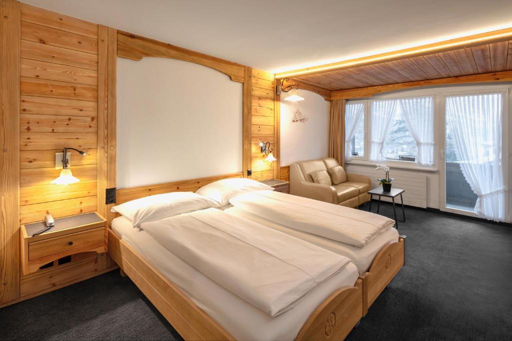 Postel nebo postele na pokoji v ubytování Hotel Antika