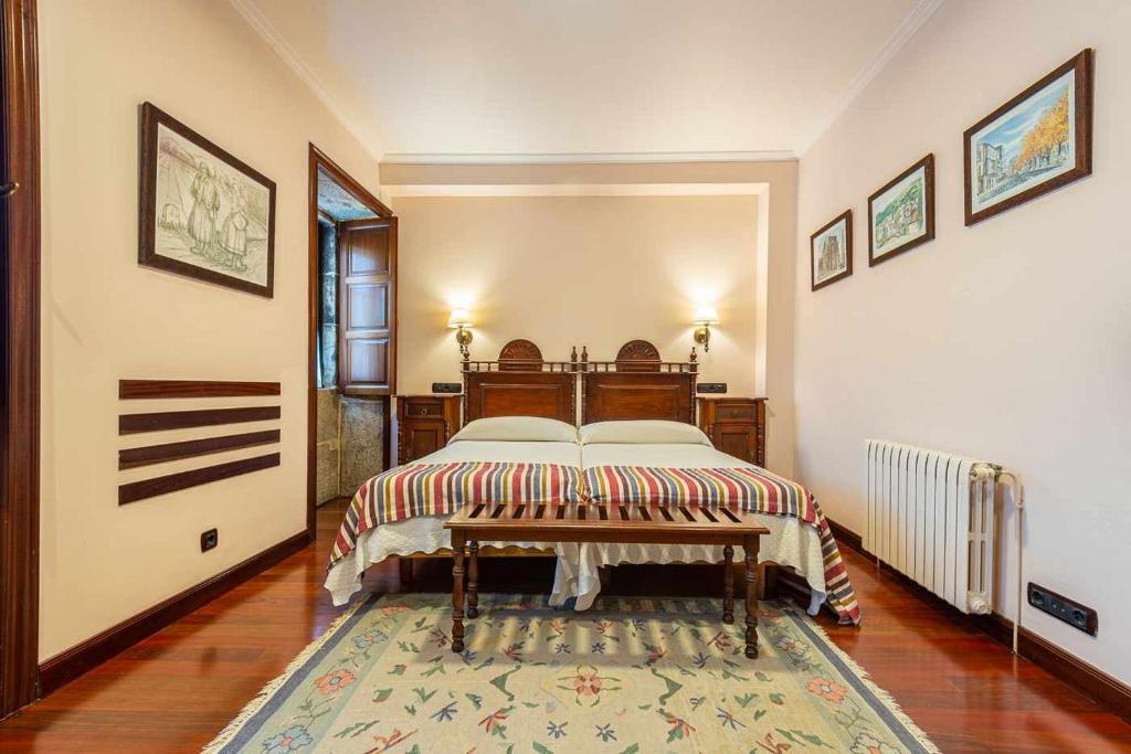 Postel nebo postele na pokoji v ubytování Hotel - Casa de Turismo Rural Dugium