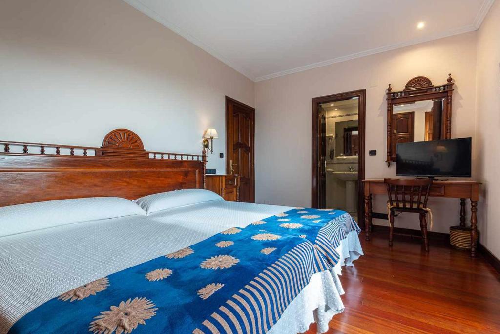 Postel nebo postele na pokoji v ubytování Hotel - Casa de Turismo Rural Dugium