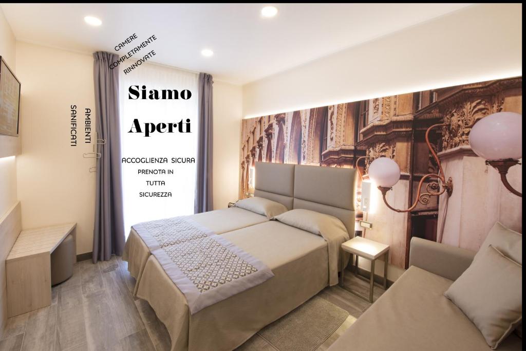 Postel nebo postele na pokoji v ubytování Hotel Sempione