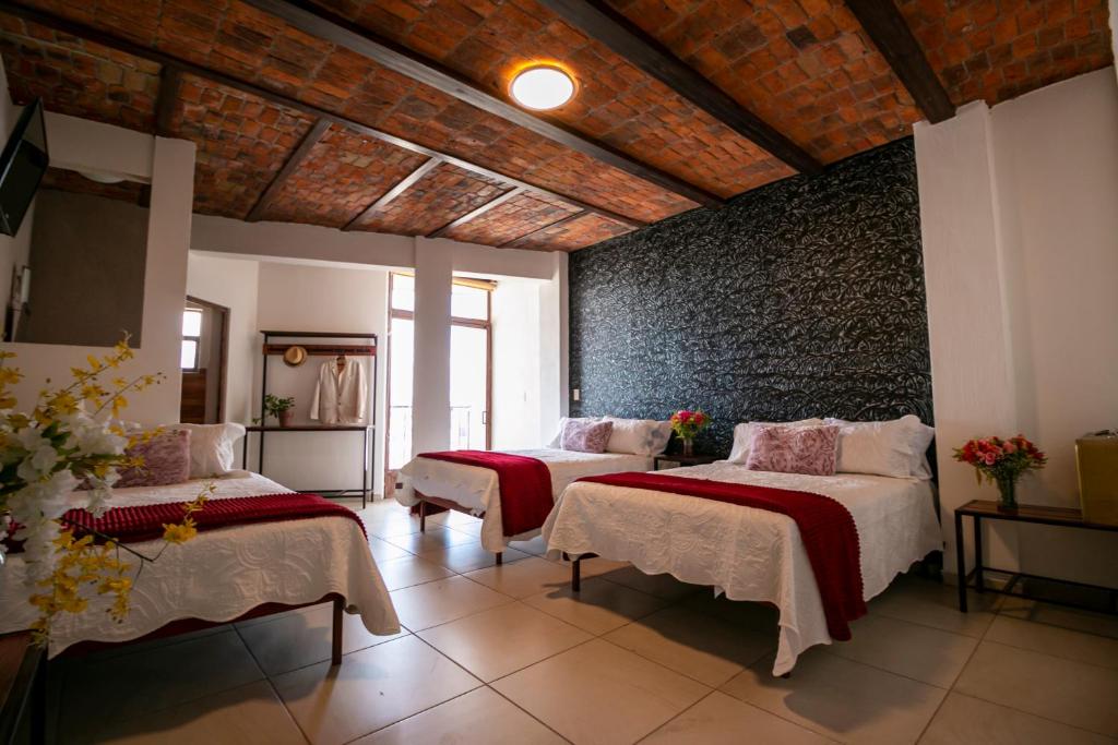 Postel nebo postele na pokoji v ubytování Casa De Rey