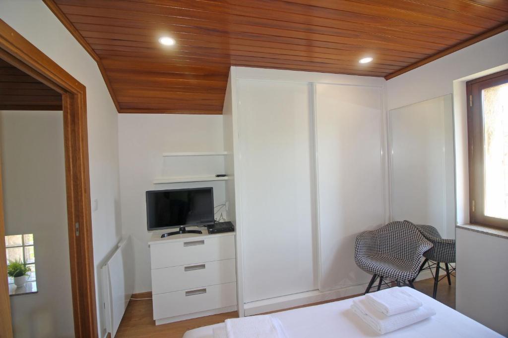 TV a/nebo společenská místnost v ubytování Casa da Terrada by Gerês Casas