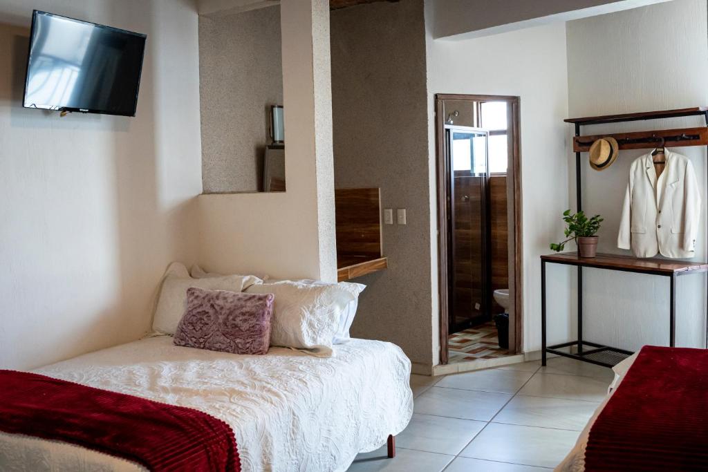 Postel nebo postele na pokoji v ubytování Casa De Rey