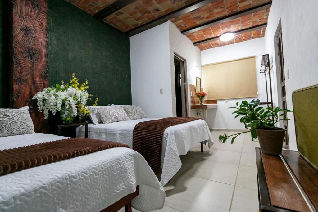 Postel nebo postele na pokoji v ubytování Casa De Rey