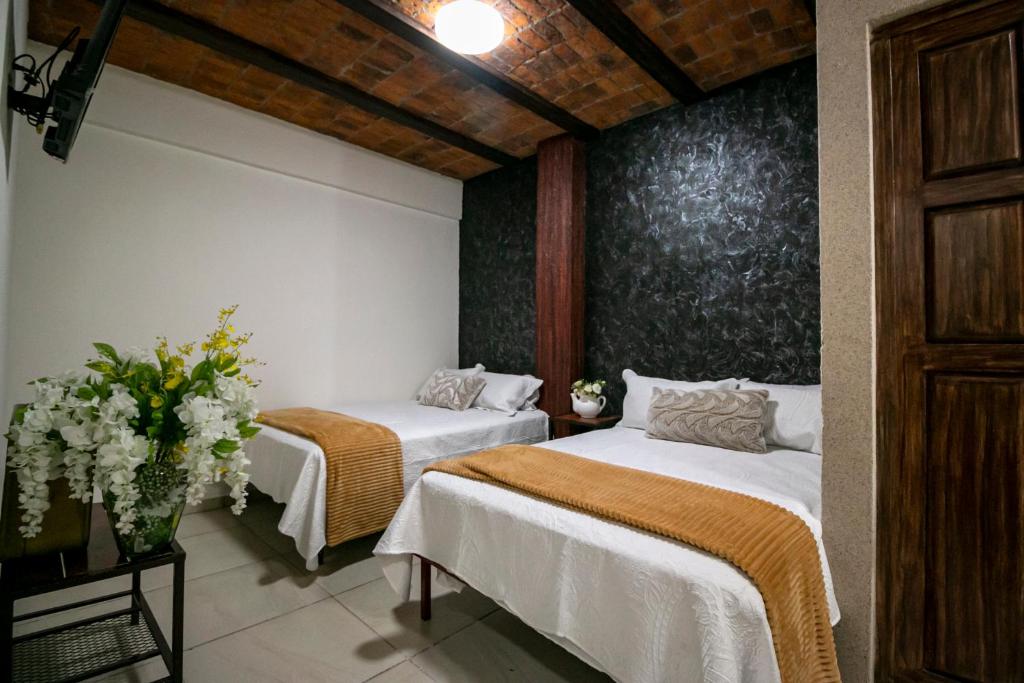 Postel nebo postele na pokoji v ubytování Casa De Rey