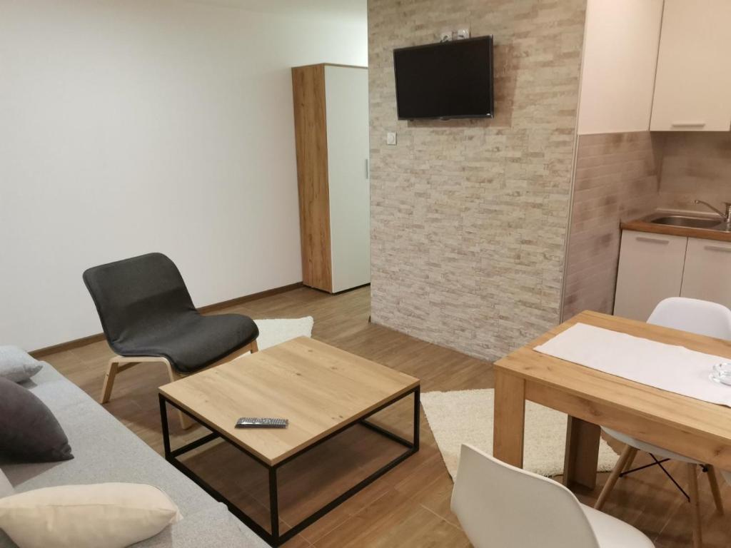 a living room with a couch and a table at Vila Vrh in Crni Vrh