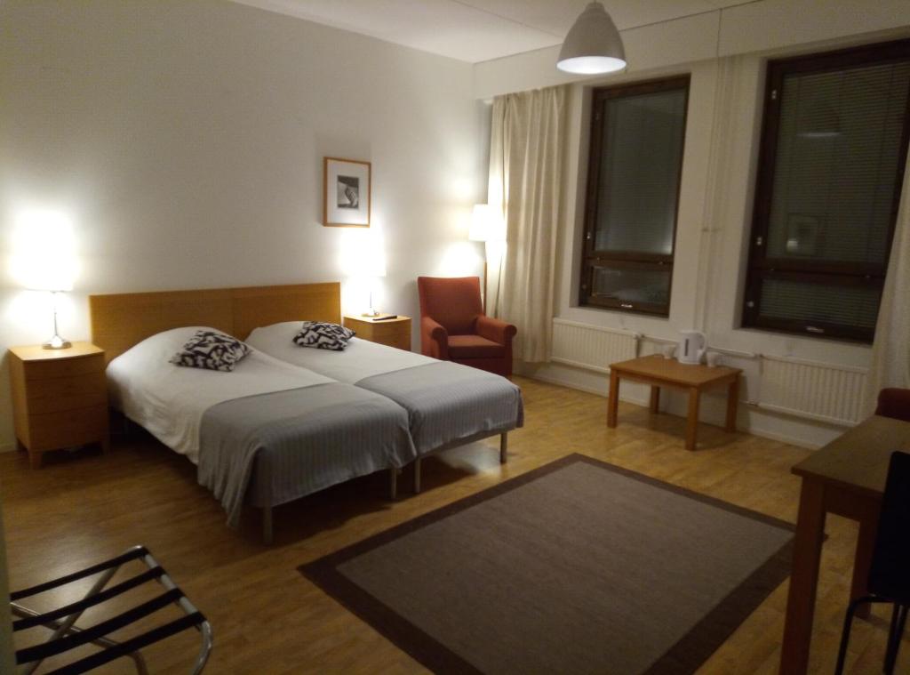 Un pat sau paturi într-o cameră la Hostel Vekotin