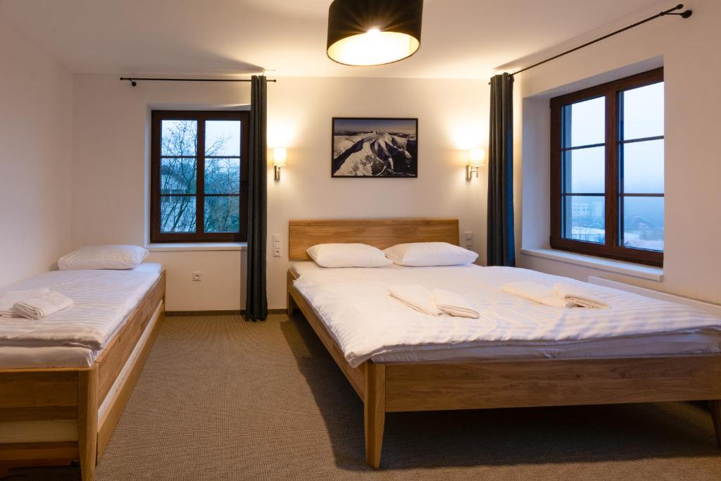 Postel nebo postele na pokoji v ubytování Apartmány Sára