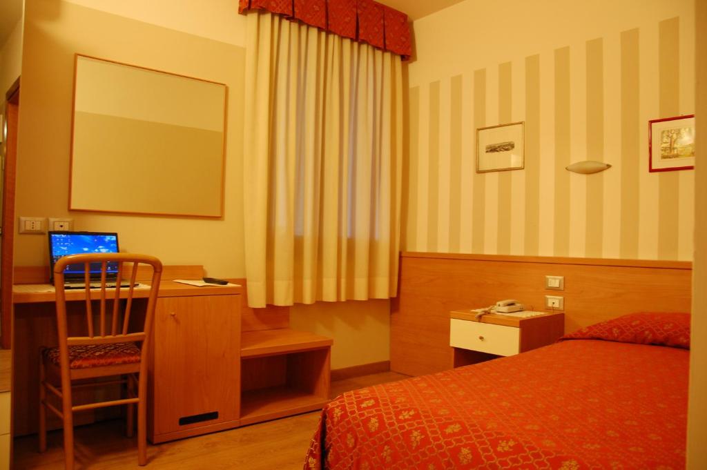 Postel nebo postele na pokoji v ubytování Hotel Belie