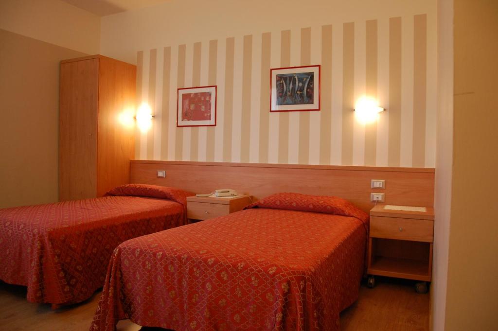Postel nebo postele na pokoji v ubytování Hotel Belie