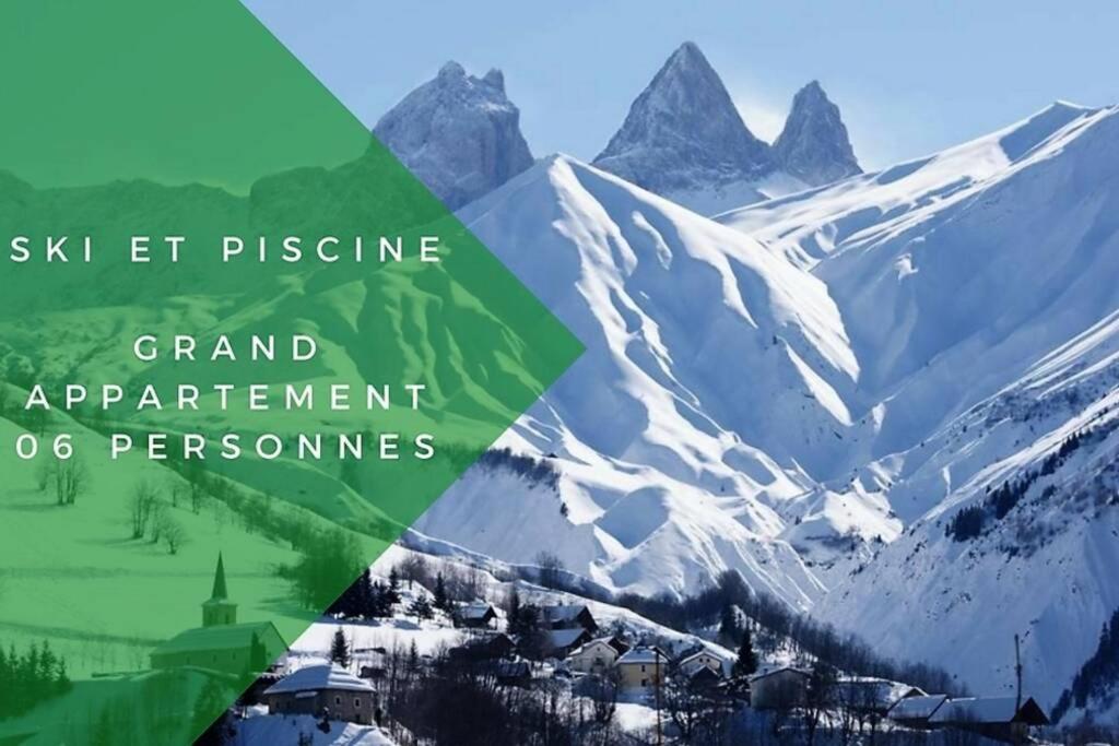 een uitzicht op een besneeuwde berg met de woorden ski et discipline grand appartement programma's bij Le Cottage des Sybelles in Saint-Sorlin-dʼArves