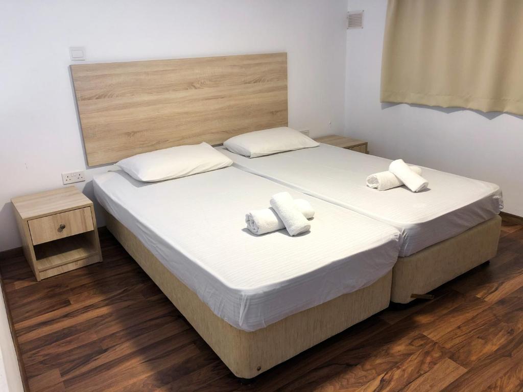 Postel nebo postele na pokoji v ubytování Cozy Loft Apartment 2