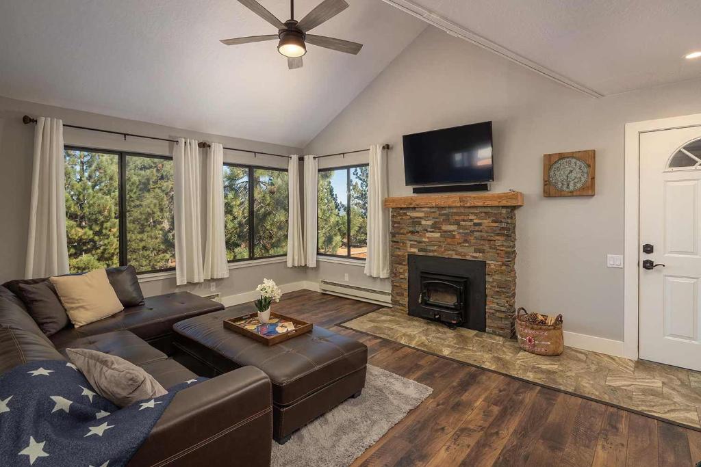 a living room with a couch and a fireplace at My Oasis at Ski Bowl Condos in Truckee