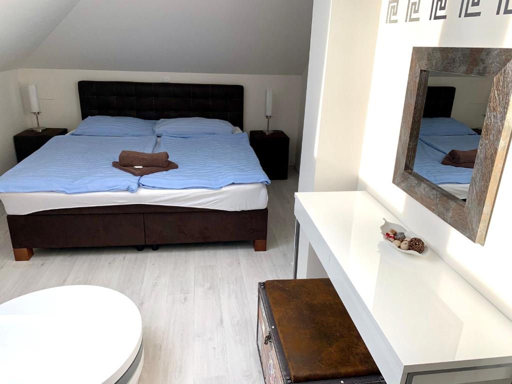 Postel nebo postele na pokoji v ubytování Hotel Stará Pošta
