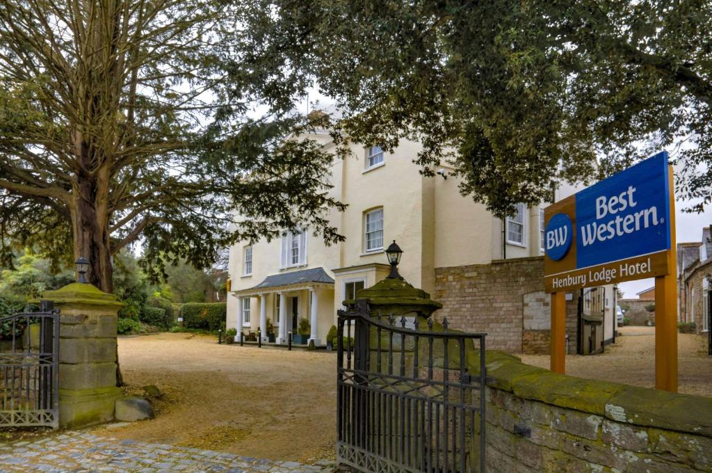 a best western sign in front of a white house at Best Western Henbury Lodge Hotel in Bristol