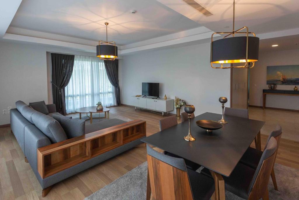 a living room with a couch and a table at Maslak Aparts in Istanbul
