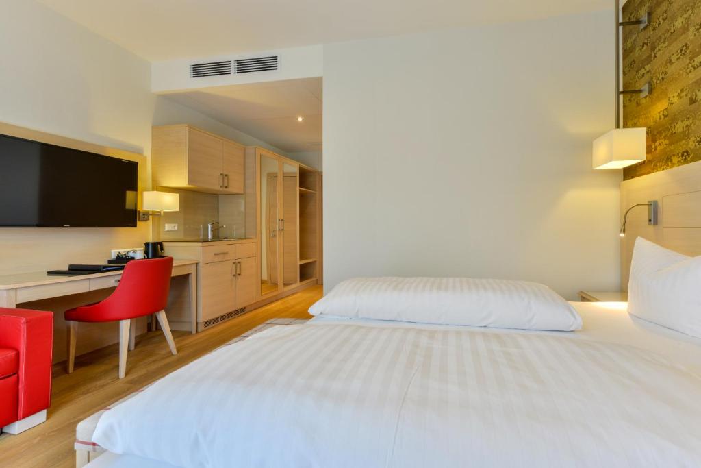 Postel nebo postele na pokoji v ubytování Hotel Pöker