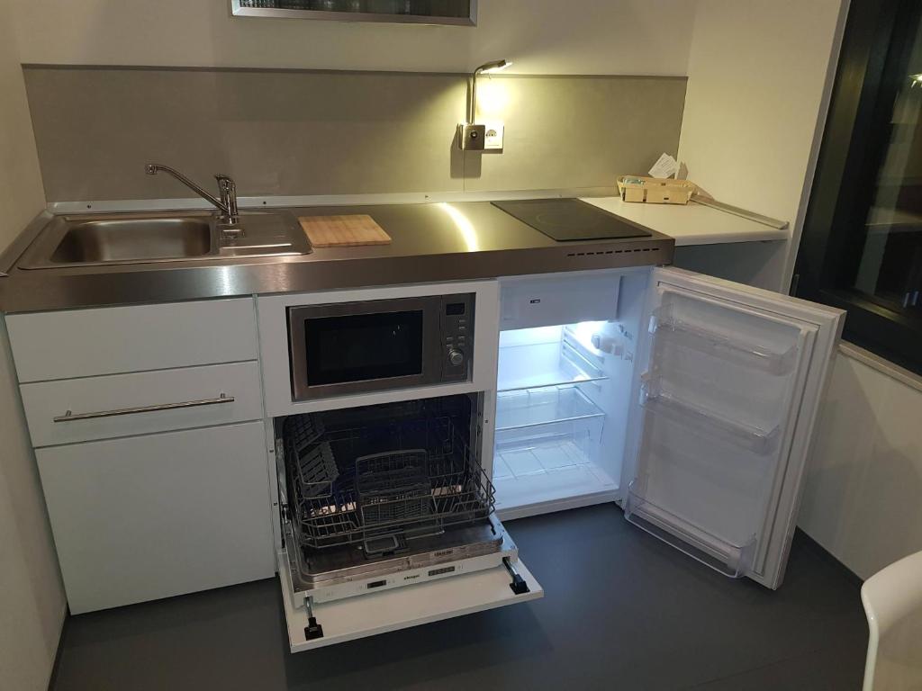 Kuchyň nebo kuchyňský kout v ubytování BikeHikeSleep Apartments