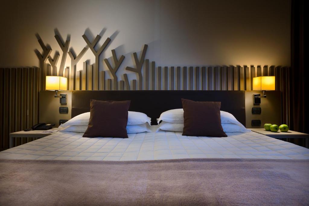 Postel nebo postele na pokoji v ubytování Hotel Desenzano