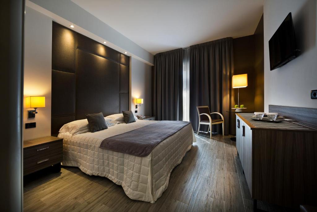 Postel nebo postele na pokoji v ubytování Hotel Desenzano