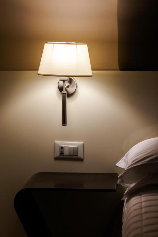 Postel nebo postele na pokoji v ubytování Hotel Desenzano