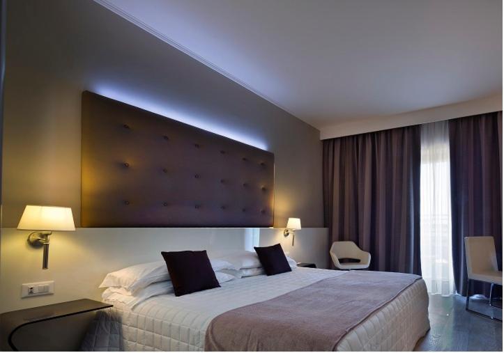 Postel nebo postele na pokoji v ubytování Hotel Desenzano
