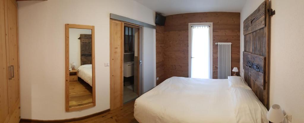 Posteľ alebo postele v izbe v ubytovaní Albergo Soldanella