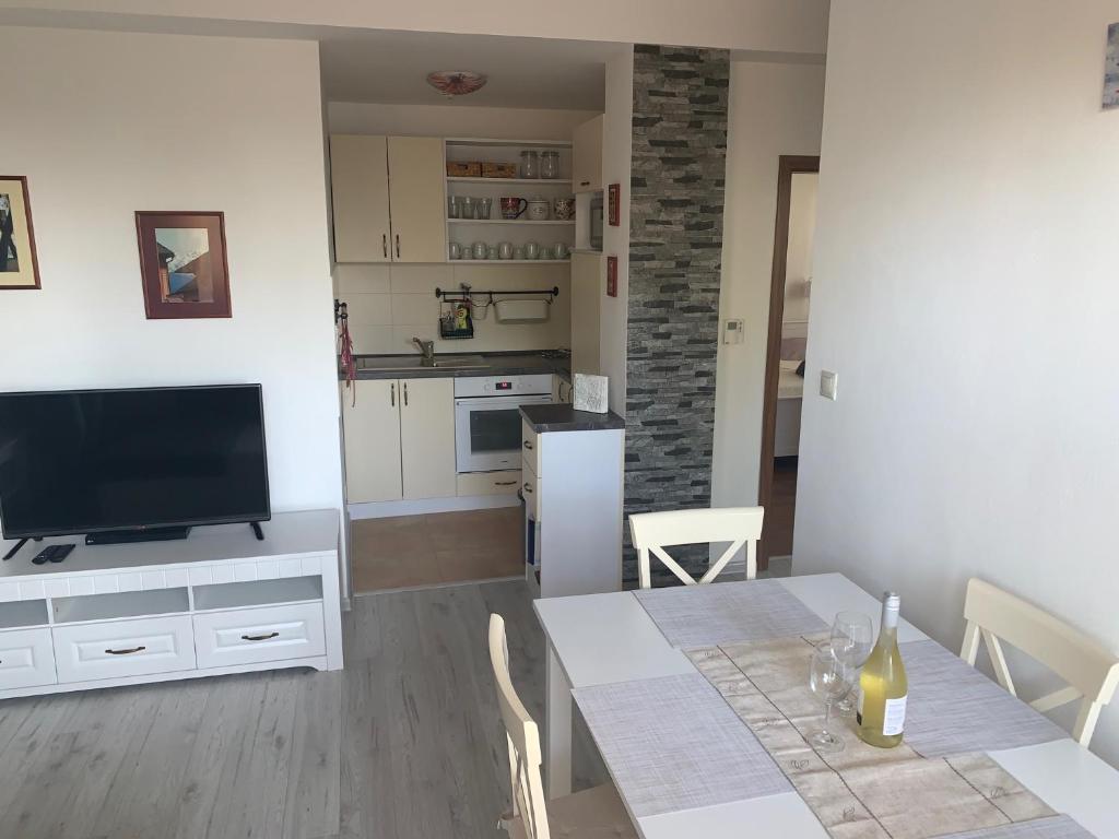 A kitchen or kitchenette at Apartmán Lesníček