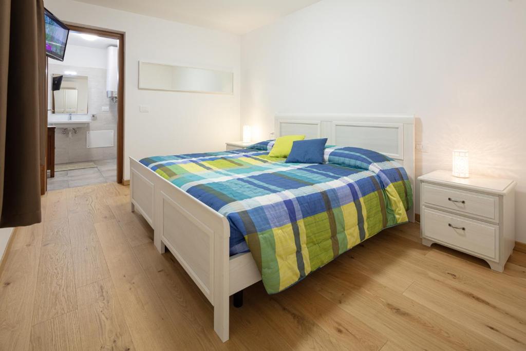 Letto o letti in una camera di Agriturismo I Comelli