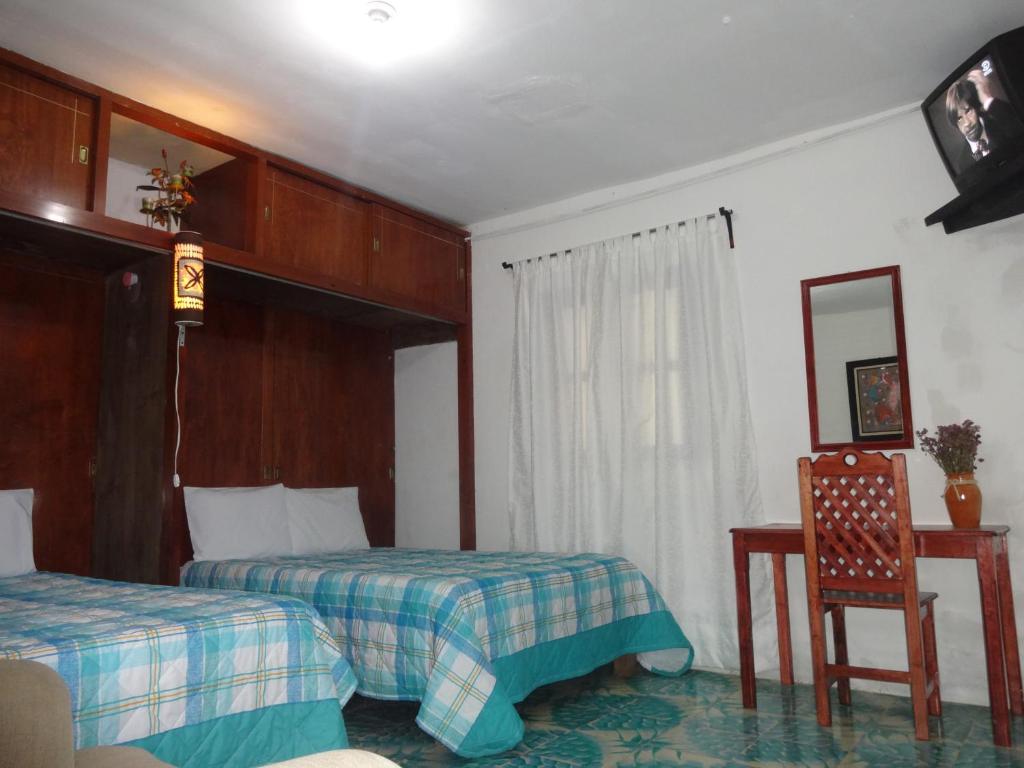 Hotel Posada El Gran Cipres - Quadruple Room With Garden View