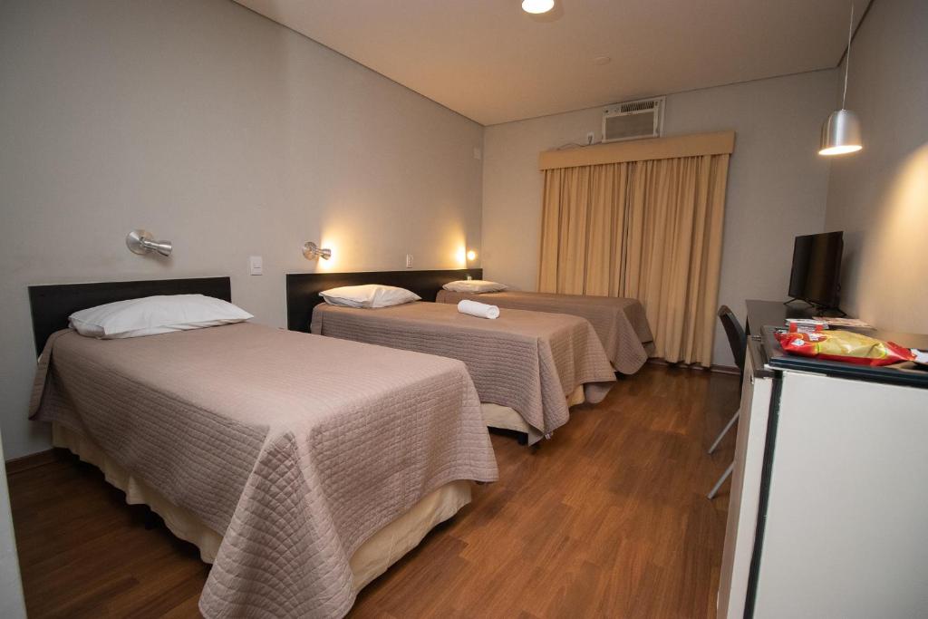 Postel nebo postele na pokoji v ubytování Hotel Bramig