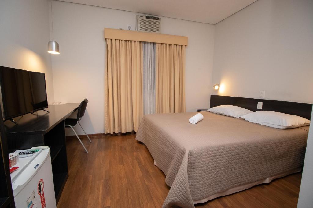 Postel nebo postele na pokoji v ubytování Hotel Bramig