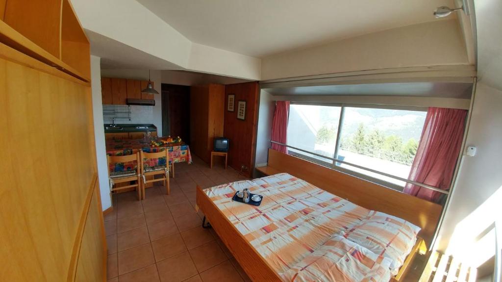 Postel nebo postele na pokoji v ubytování Res. Sole Alto appartamenti Solandra