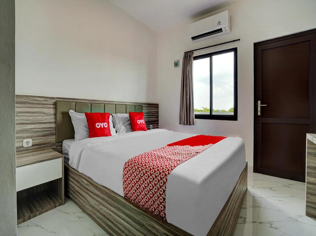Katil atau katil-katil dalam bilik di OYO Capital O 90164 La'rissa Residence