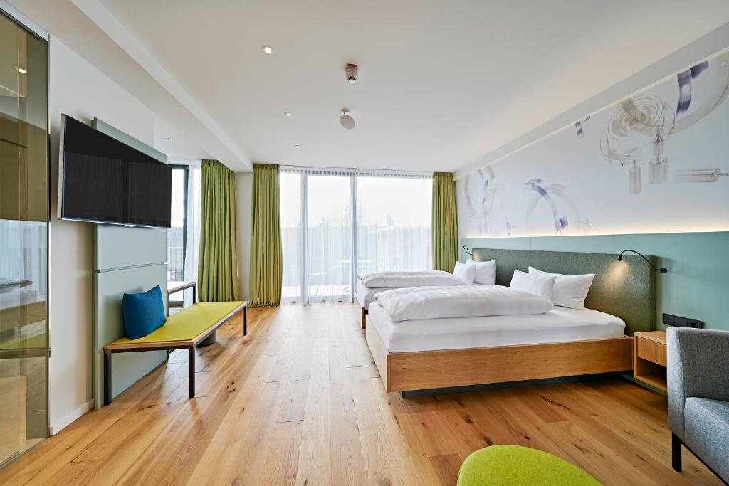 Postel nebo postele na pokoji v ubytování Hotel Federwerk