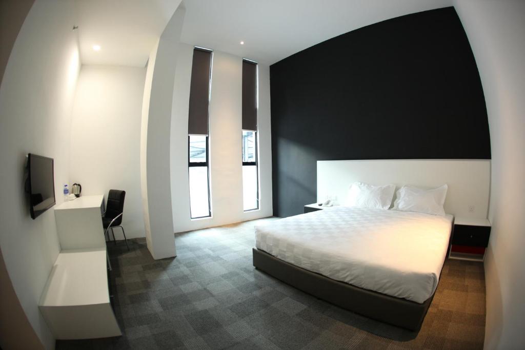 Postel nebo postele na pokoji v ubytování Beverly Hotel