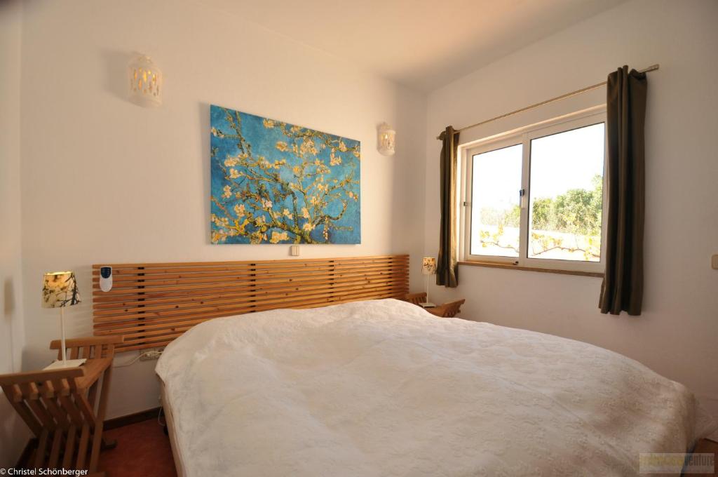 Postel nebo postele na pokoji v ubytování Casa Papoilas - V023