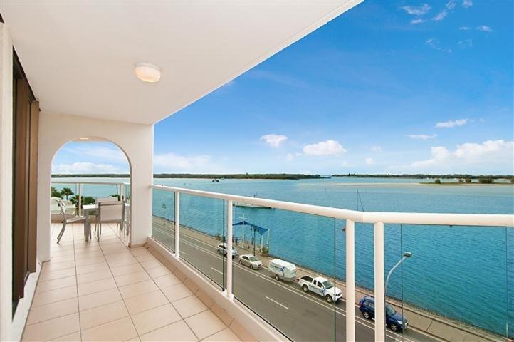 a balcony of a house with a view of the water at Beaconlea in Gold Coast