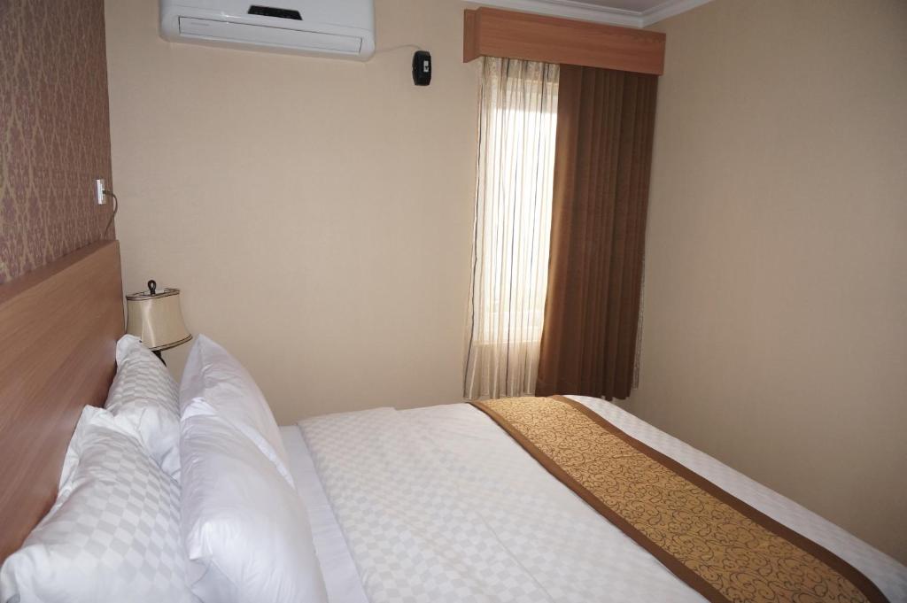 Postel nebo postele na pokoji v ubytování Safa Homestay
