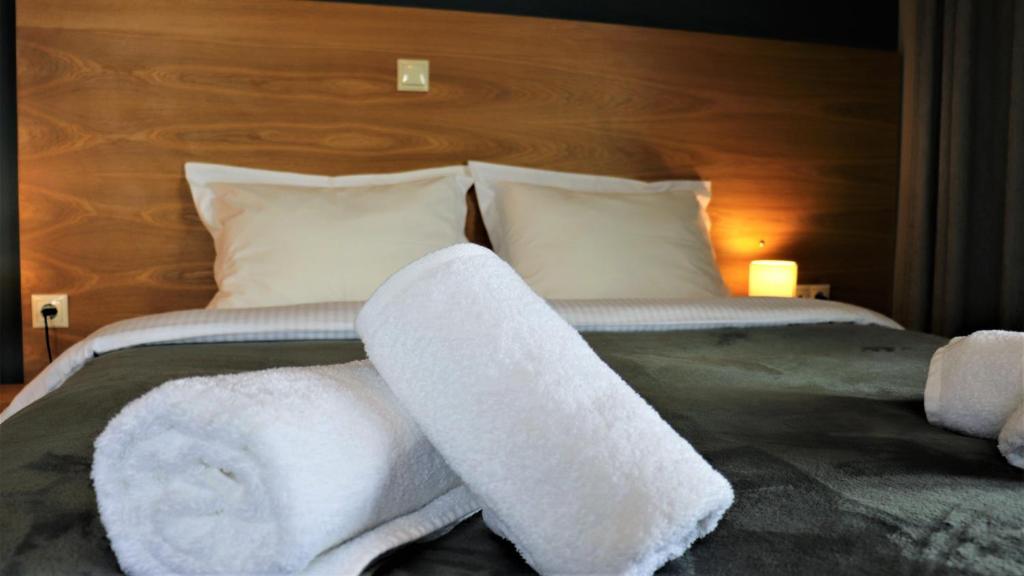 Postel nebo postele na pokoji v ubytování Hara Hotel