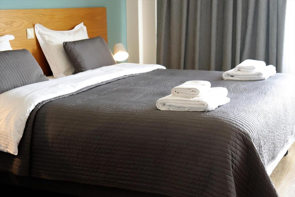 Postel nebo postele na pokoji v ubytování Hara Hotel