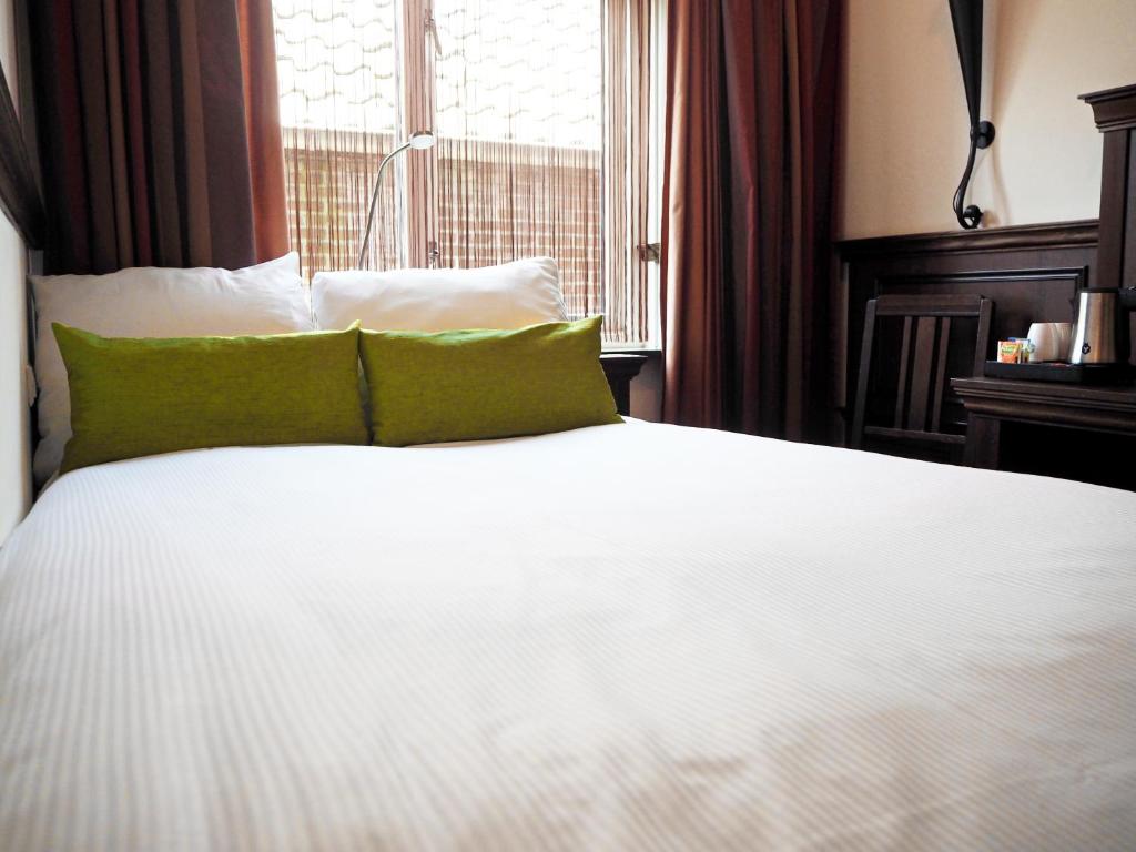 Postel nebo postele na pokoji v ubytování Boutique Hotel, Restaurant & Wellness Westerburcht