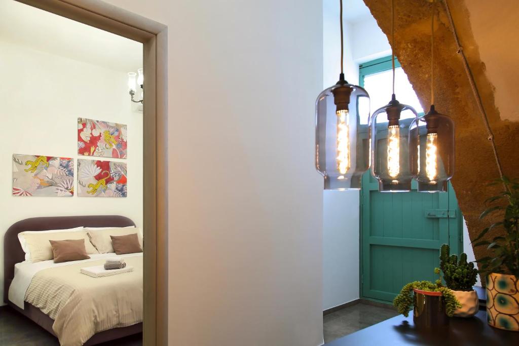 Postel nebo postele na pokoji v ubytování B&B RONCO ZAFFARANA