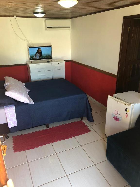 Cama ou camas em um quarto em Pousada Ilha do Mel
