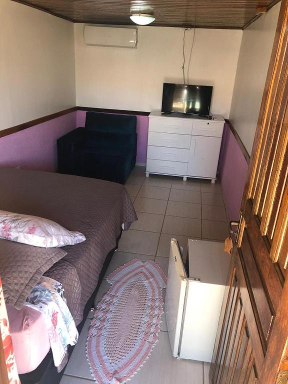 Cama ou camas em um quarto em Pousada Ilha do Mel